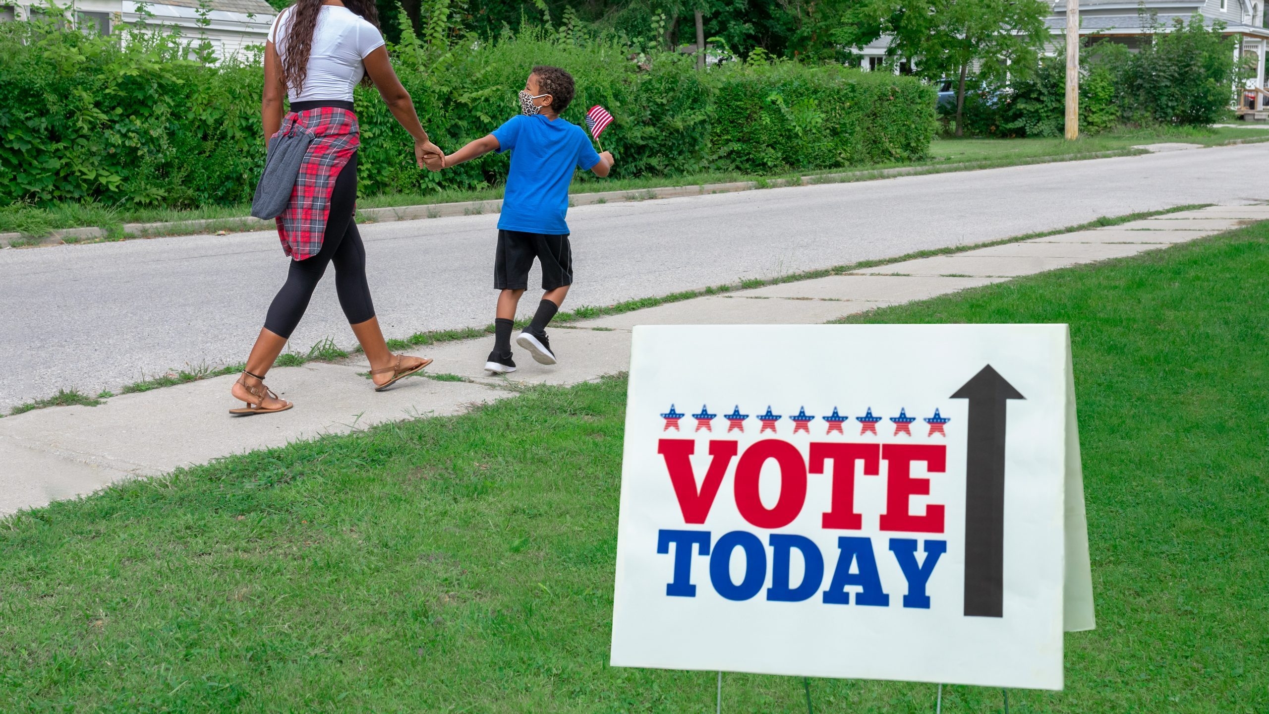 Governor signs legislation to codify ban on curbside voting