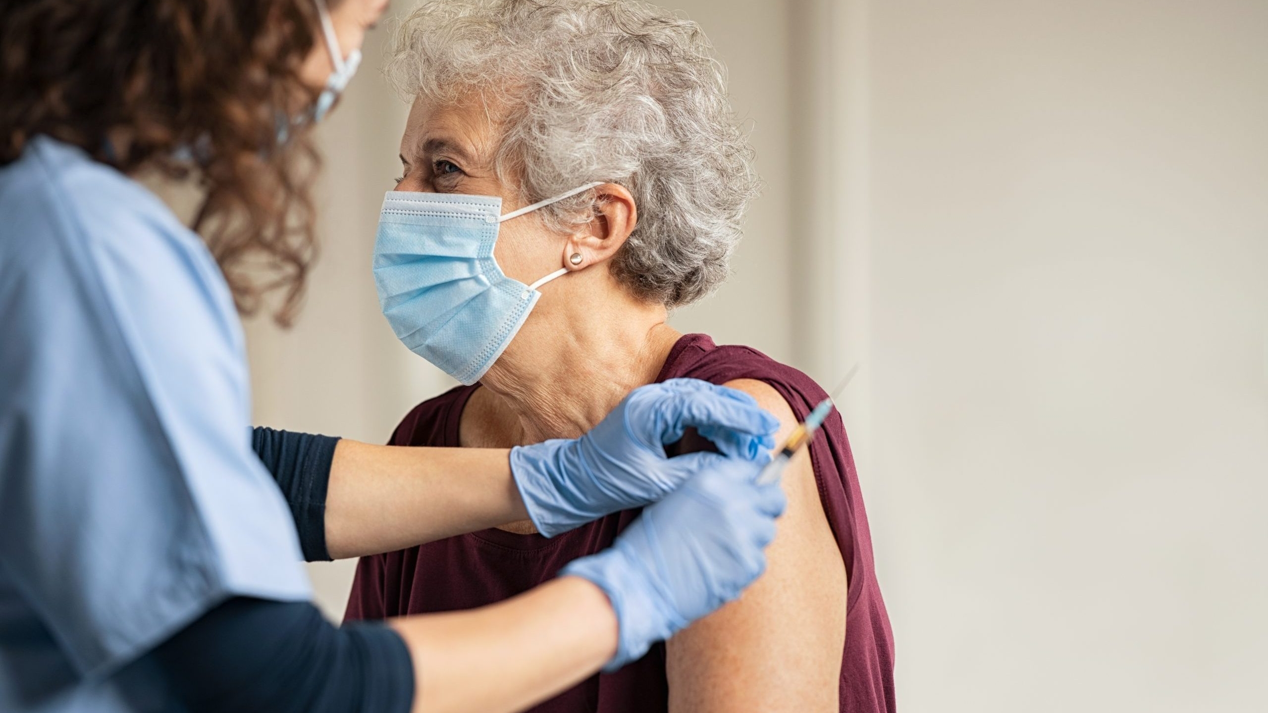 Health officials plan for vaccines but urge public to wear masks, social distance