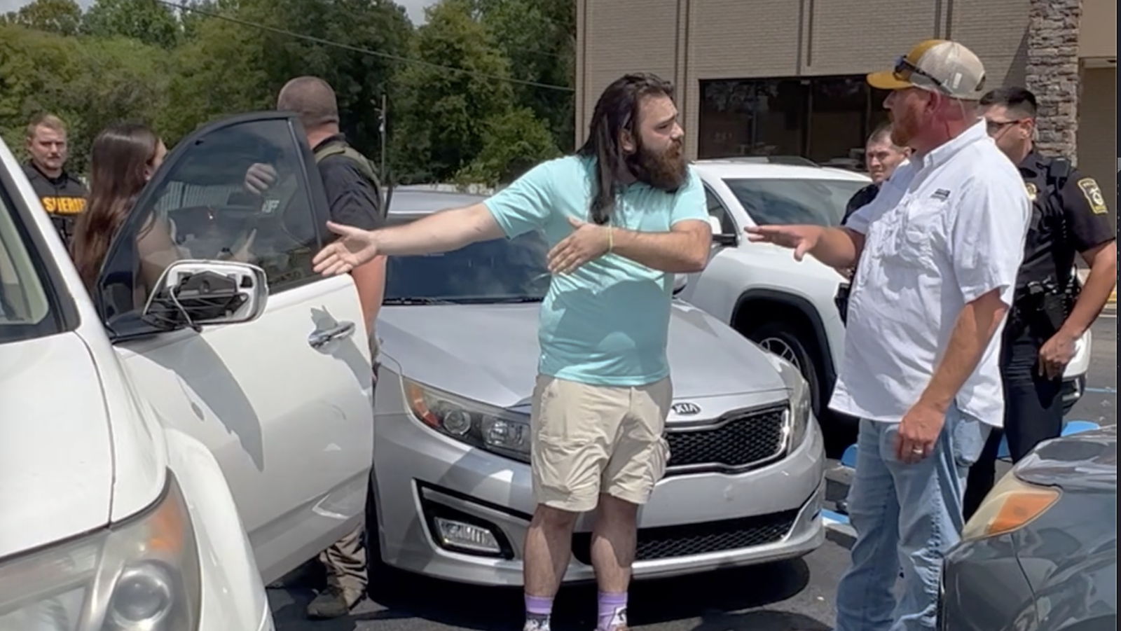 Tense Ozark library meeting spills into parking lot between undercover cop, LGBTQ speaker