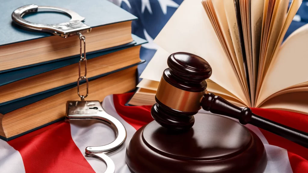 Gavel, books and handcuffs