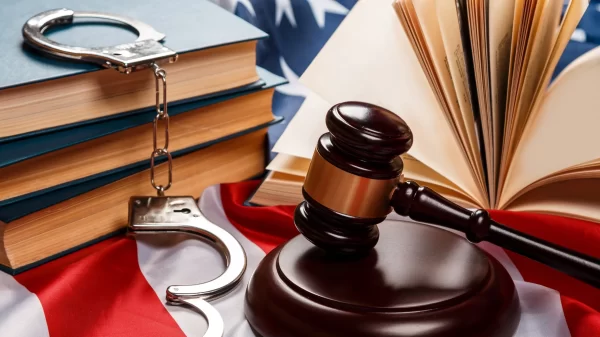 Gavel, books and handcuffs