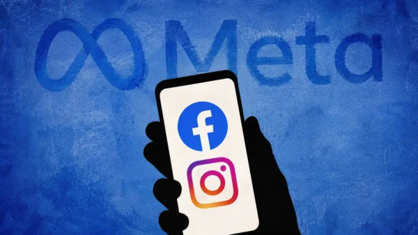 Illustration of a silhouetted hand holding a smartphone displaying Facebook and Instagram logos beneath the Meta logo.
